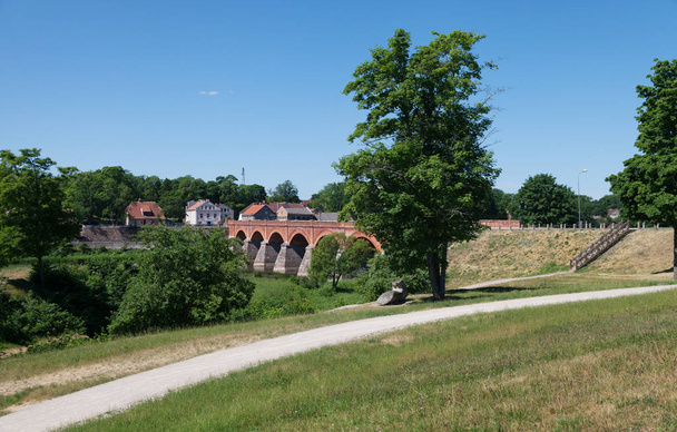 View to the old brick bridge in Kuldiga. - Photo, Image