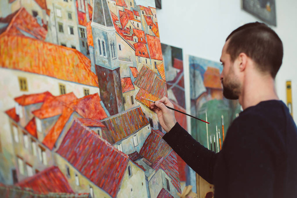 man is painting colorful city - Photo, Image