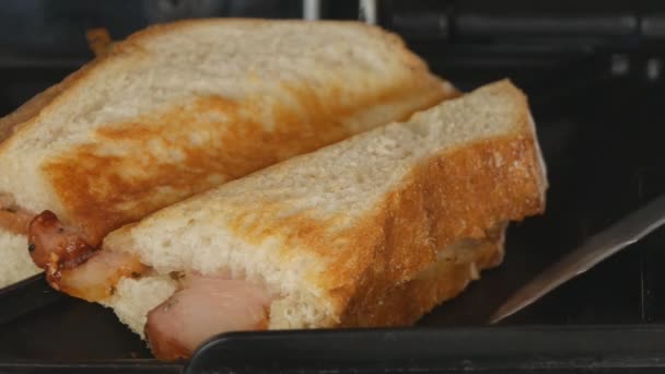 Close Up Image with Hot and Tasty Bacon Sandwich Taken from a Sandwich Maker - Filmati, video