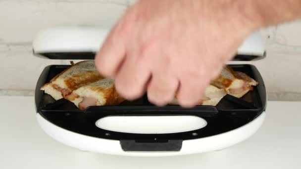 Man Make Breakfast with Electric Sandwich Maker Using Fresh Bread and Bacon - Filmagem, Vídeo