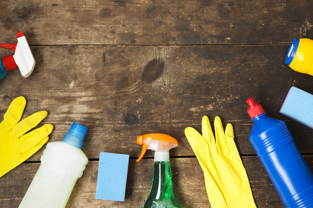 House cleaning products variety on wooden background, top view. From above, flat lay. Copy space. - Photo, Image