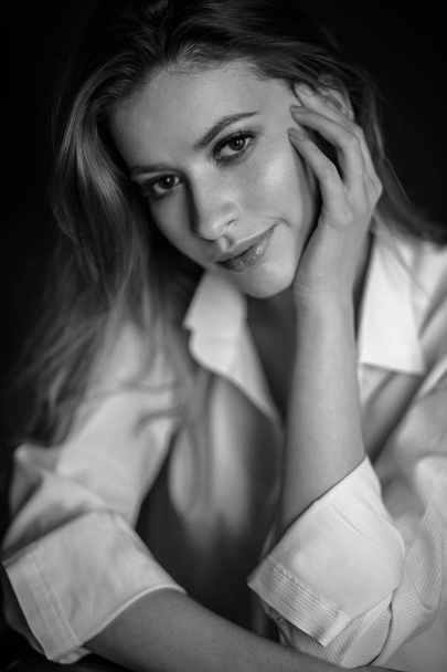 Classic portrait of sensual young woman in a simple clothes. Emotional close-up photo - Zdjęcie, obraz