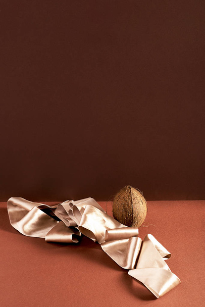 One whole coconut and ribbon - Photo, Image