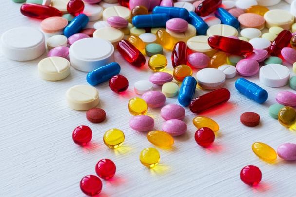 Many colorful medicines. Pills and capsules on white background. - Valokuva, kuva