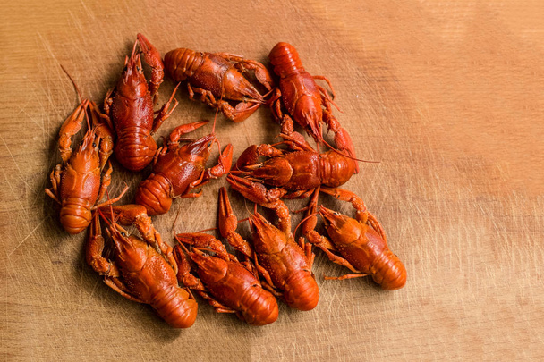 soft focus boiled crayfish on brown desk food and drinks concept with empty space for copy or text - Foto, Bild