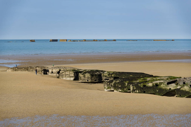Arromanches - April 6, 2015: The remains of the Mulberry Harbour at Arromanches, Normandy France - Photo, Image