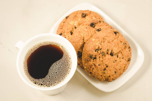 coffee cup and homemade cookies with chocolate/Breakfast whith coffee cup and homemade cookies with chocolate, top view - Φωτογραφία, εικόνα