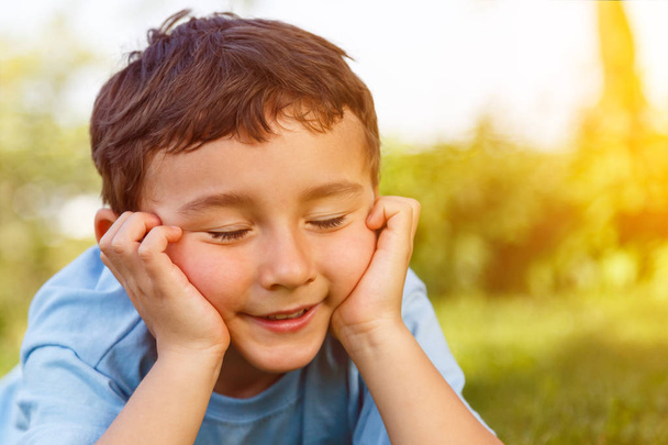 Child kid little boy day dreaming daydreaming thinking outdoor copyspace copy space outdoors outside nature - Photo, Image