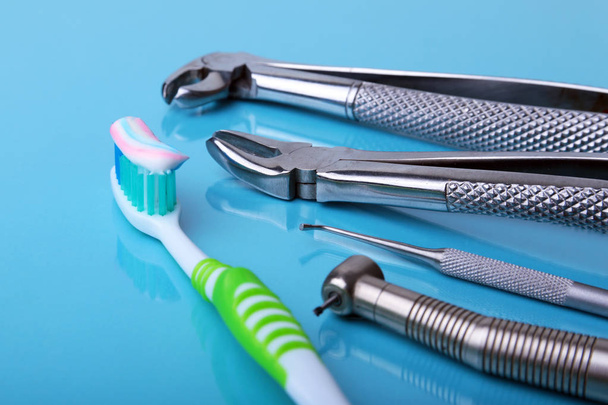 dental care toothbrush with dentist tools on mirror background - Foto, Imagen