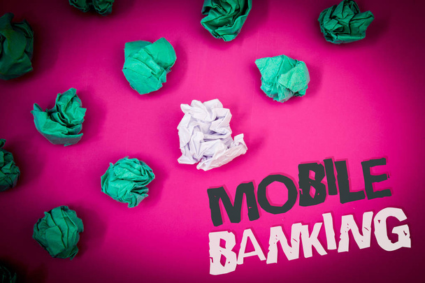 Writing note showing  Mobile Banking. Business photo showcasing Online Money Payments and Transactions Virtual Bank Text Words pink background crumbled paper notes stress written angry - Photo, Image