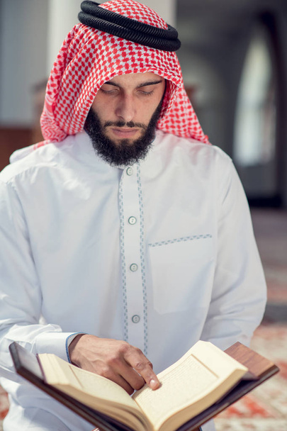 Religious muslim man praying inside the mosque - Photo, image