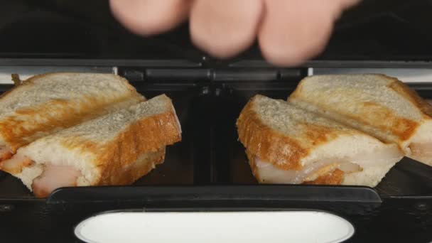 Close Up Man Checking Roasted Sandwiches Opening and Closing Sandwich Maker - 映像、動画
