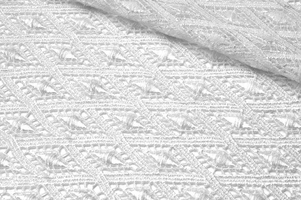 Текстура фонового візерунка. Ледача біла тканина. Мереживо ручної роботи на білому тлі. Білий гіпюр, вишивка на тканині для весільної сукні
,  - Фото, зображення