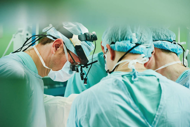 cardio surgery operating room. male cardiac surgeon in hospital - Фото, изображение