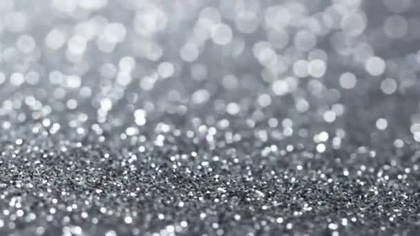 Ezüst csillámpor textúra forgatható. Absztrakt fényes háttér. - Felvétel, videó