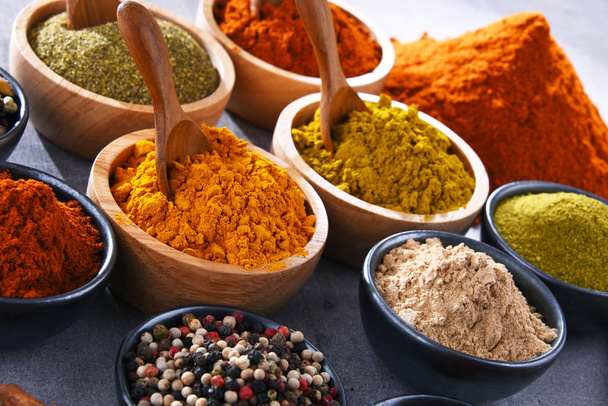 Variety of spices on kitchen table. - Φωτογραφία, εικόνα