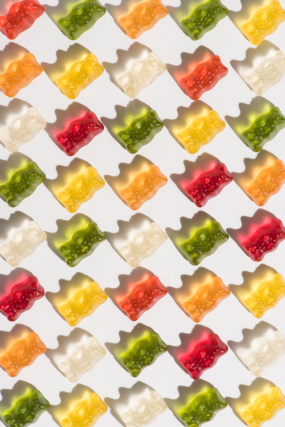 full frame shot of sweet gummy bears pattern on white - Valokuva, kuva
