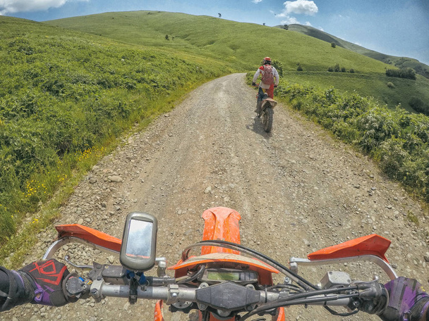 Bike speed journey in the mountains with the dirt bike Enduro in Caucasus Georgia - 写真・画像
