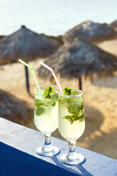 Two glasses of Mojito cocktail in the beach bar - Fotó, kép