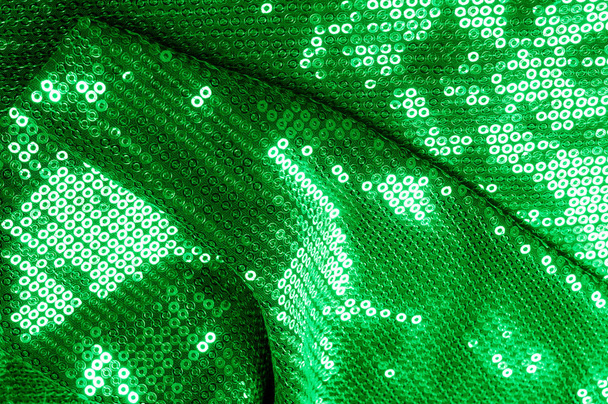 Background texture, pattern. The fabric is dark green with sequins. Make a statement with sequins ! Presenting the stylish Two-toned Paillette Sequins on the nylon spandex stretch backing. - Photo, Image