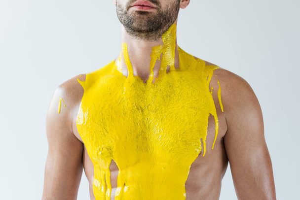 Bearded man covered with yellow paint isolated on white background - Fotoğraf, Görsel