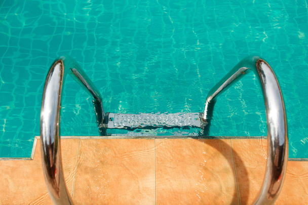 Ladder in the pool with beautiful clean water - Fotó, kép