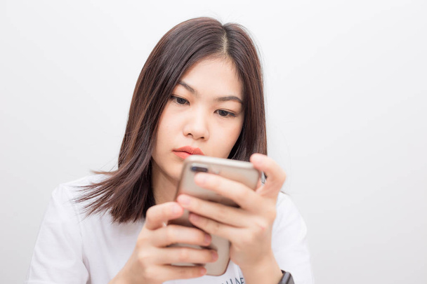 Beautiful short hair women texting message on smartphone on white background - Foto, Bild