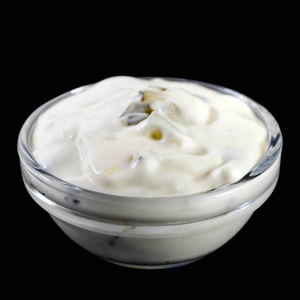 White garlic and herbs sauce in a small glass bowl isolated on b - Φωτογραφία, εικόνα