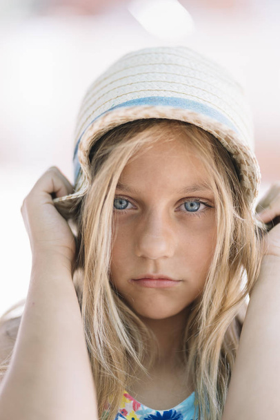 Little girl with a hat outdoors - Photo, Image