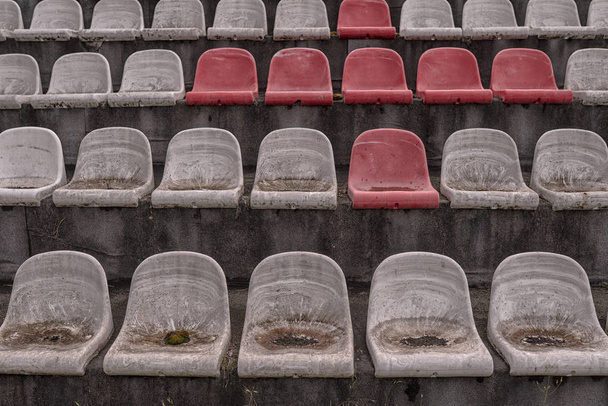 Vintage Stadium Chairs old time not used with dust red and white colors - Foto, Imagem
