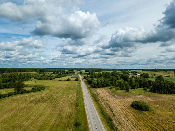 drone image. aerial view of rural area with fields and road network. latvia - 写真・画像