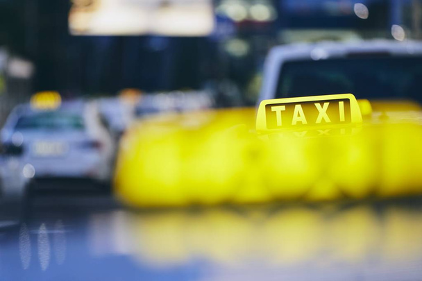 Lighting taxi sign. Cars against city street at night. Prague, Czech Republic. - Photo, Image