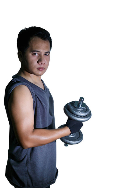 Un homme haltère de levage pour la formation de poids pour le muscle du bras avec photo de style sombre, isolé sur fond blanc
. - Photo, image