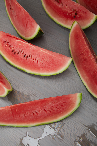 food composition with fresh watermelon slices on grey wooden surface - Fotoğraf, Görsel