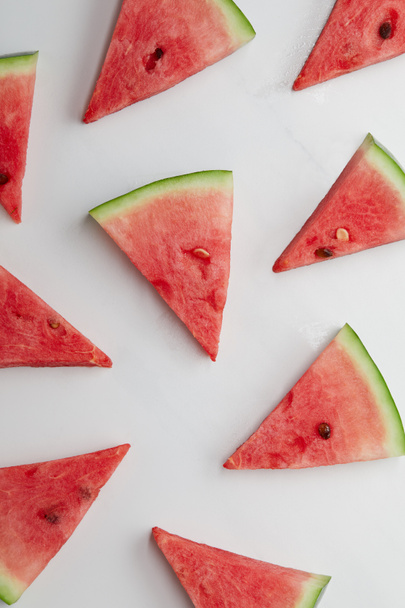 food composition with ripe watermelon slices arranged on white surface - Valokuva, kuva