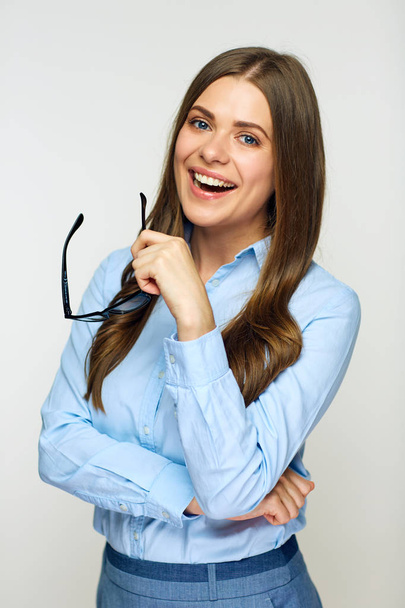 Smiling woman in blue shirt with eyeglasses looking at camera  - Fotografie, Obrázek