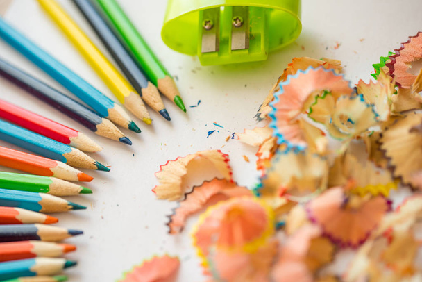 colored pencil shaving on white background. school education concept. - Foto, Imagem