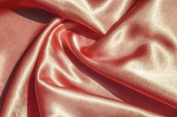 Texture, fabric, background. Abstract background of luxurious fabric or liquid waves or wavy grunge crease silk satin texture of velvet material or luxurious Christmas or elegant background. gold - Photo, Image
