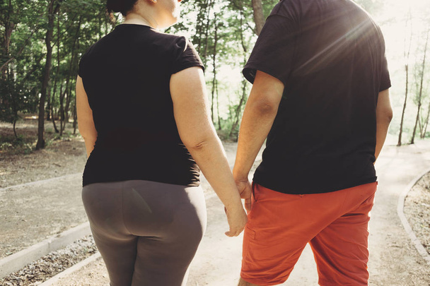 Overweight couple walking together - Photo, image