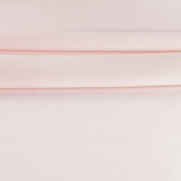 Tkanina blady róż. tkanki, tekstylia, tkaniny, tkaniny, materiał, tekstura. studio fotograficzne - Zdjęcie, obraz