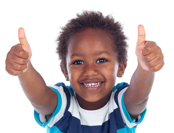 親指に分離の白い背景を示す面白いと幸せのアフリカ小さな男の子 - 写真・画像