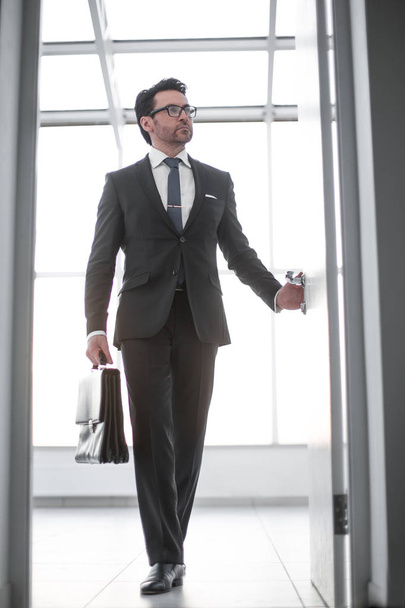 businessman with a leather briefcase entering his clients office. - Photo, image