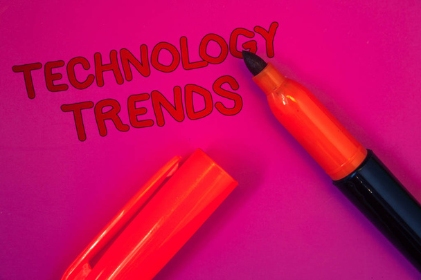 Conceptual hand writing showing Technology Trends. Business photo text Trending Modern Viral Advanced Development Trendy New Magenta color platform dark red color tidings corner red marker - Photo, Image