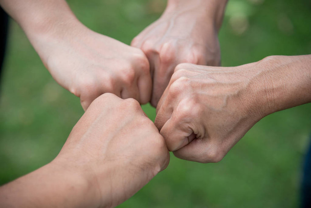people put their hands together showing teamwork power - Fotografie, Obrázek