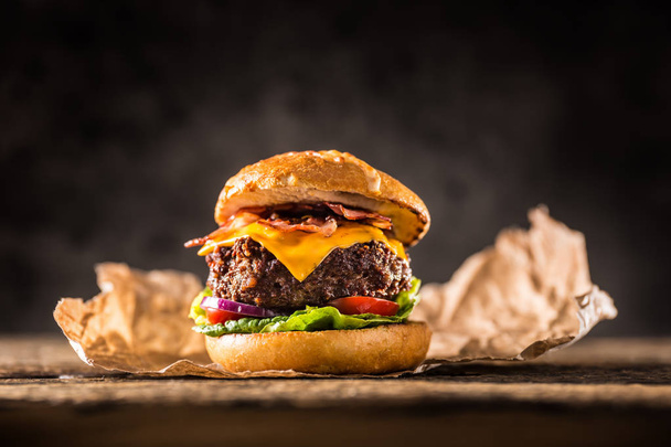 Close-up home made beef burger on wooden table. - Fotografie, Obrázek