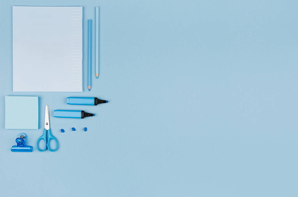 Blue office stationery collection on soft pastel blue paper  background, top view, copy space. - 写真・画像