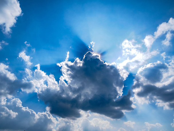 Sunbeam through the haze on blue sky: can be used as background and dramatic look - Φωτογραφία, εικόνα