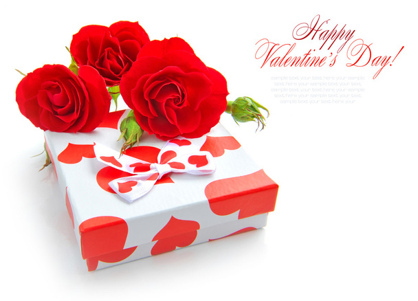 Little gift with red roses on white background - Photo, Image