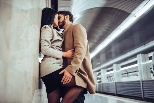 Young romantic couple in subway. Underground love story. - Photo, image