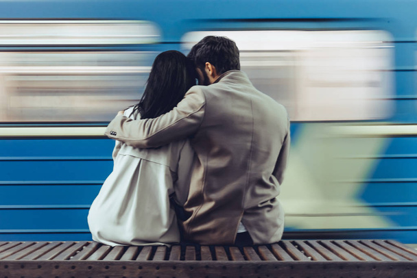 Young romantic couple in subway. Underground love story. - Fotó, kép